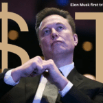 Elon Musk speaking at an event with Tesla and SpaceX logos in the background