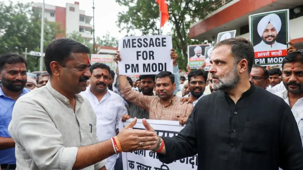 Rahul Gandhi holding a document while speaking to reporters outside Parliament during the memoir controversy.